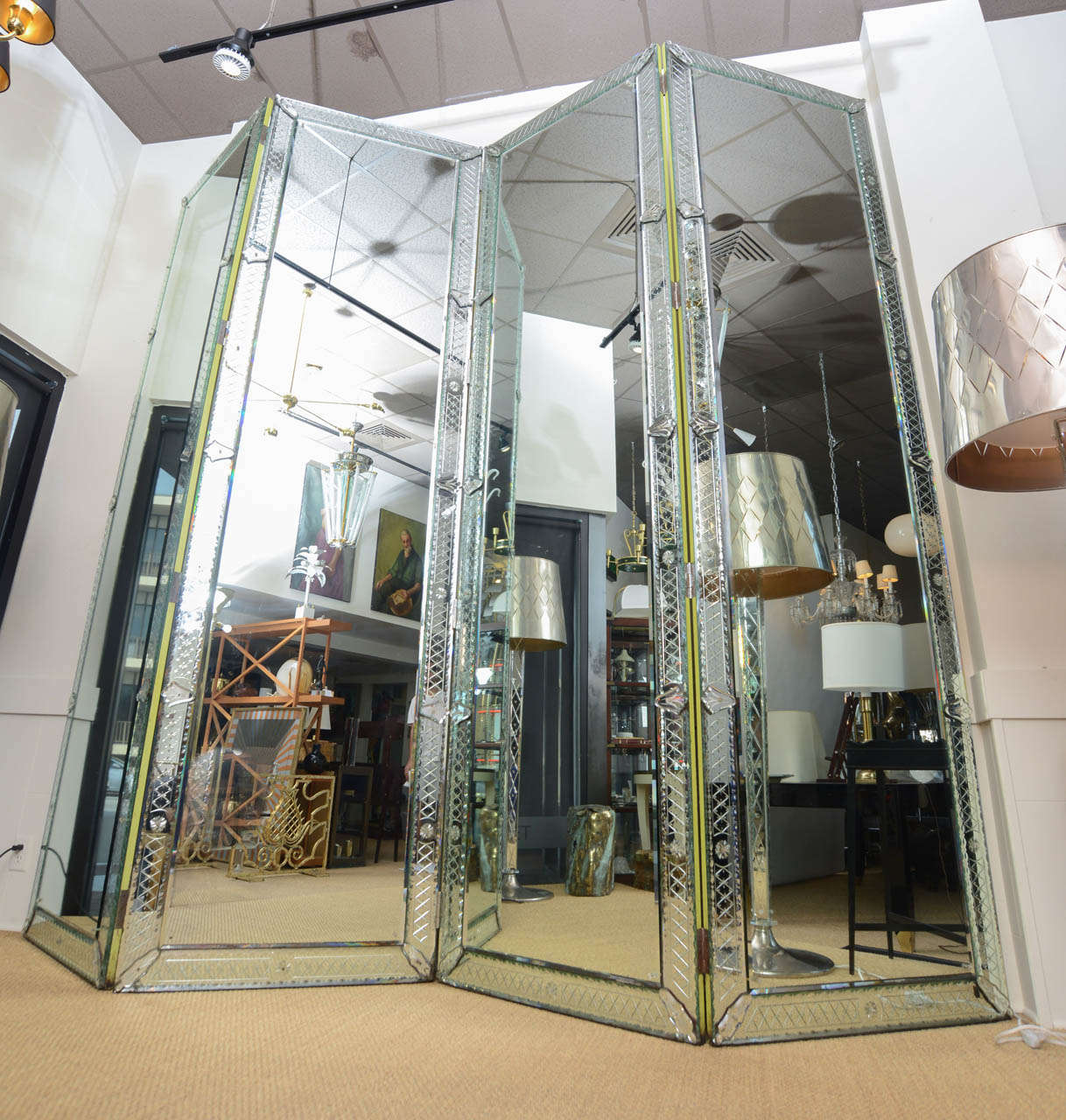 Over the top glamorous Venetian mirrors over 10 feet tall!   4 large panels make up this outstanding screen featured at The Delano Hotel designed by Philippe Starck.

Please note 35.5