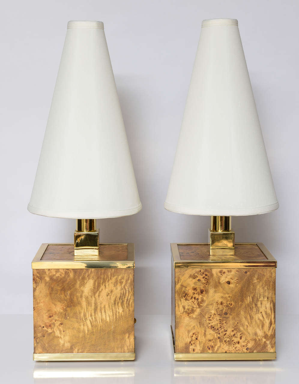 Rewired and polished, this pair of burl wood cube base lamps with polished brass trim. Custom shades included.