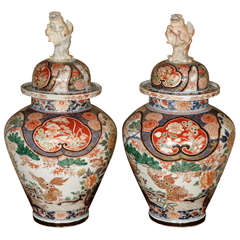 A Pair of 17th century Japanese Imari Baluster Vases with Lids