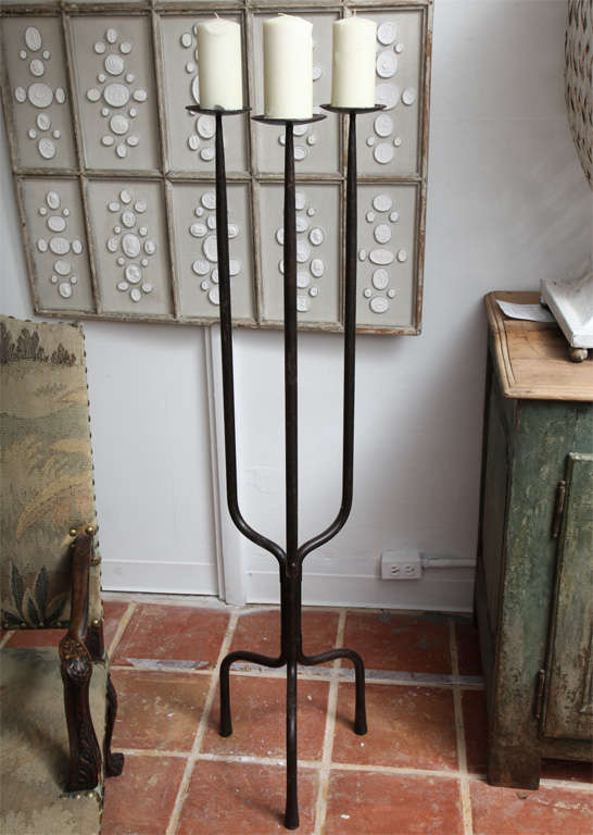A heavy cast iron three prong Candelabra