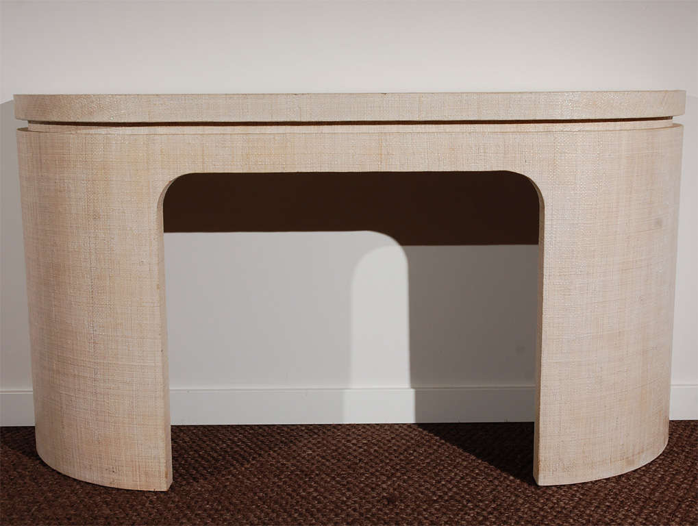 Custom console table covered in a beautiful lacquered grasscloth.  Handsomely detailed- see detail shots for examples of how the cloth wraps around the inside of the console.