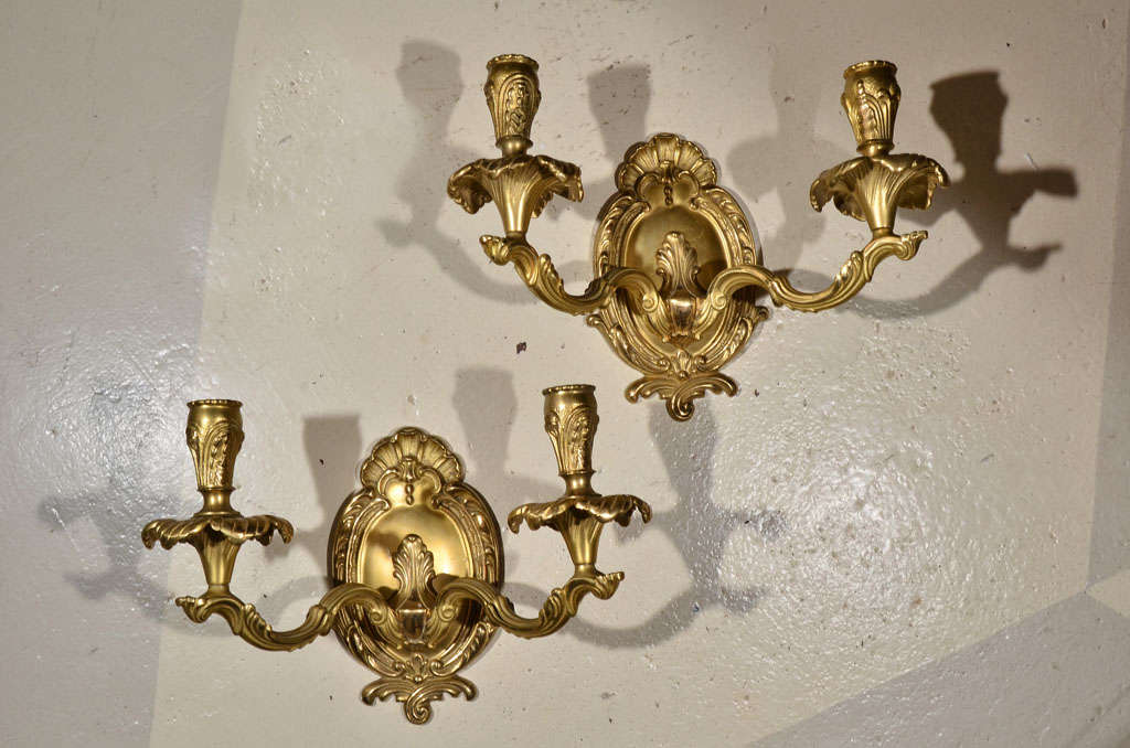 Gorgeous pair of brass two-light sconces.