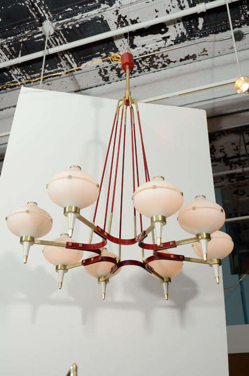 Gorgeous 8-light fixture with satin brass mounts and fire-engine-red elements.  Each arm has satin glass bowl and shades.  This fixture takes 8 candelabra bulbs, 1 bulb per arm.
*To see our entire inventory, go to www.donzella.com