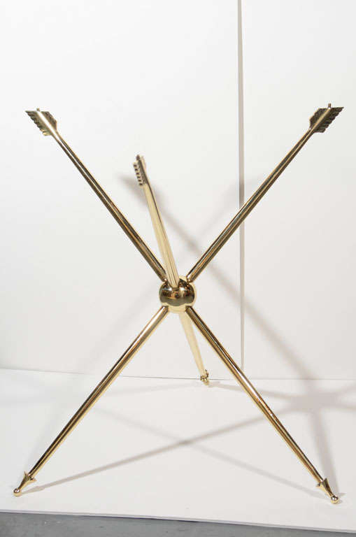 Store closing-- last day is 7/31. Offers welcome! Vintage table base consisting of three intersecting brass arrows, each fashioned with exquisite detail and craftsmanship, reminiscent of a Jansen piece. The feathered ends of all three arrows stamped