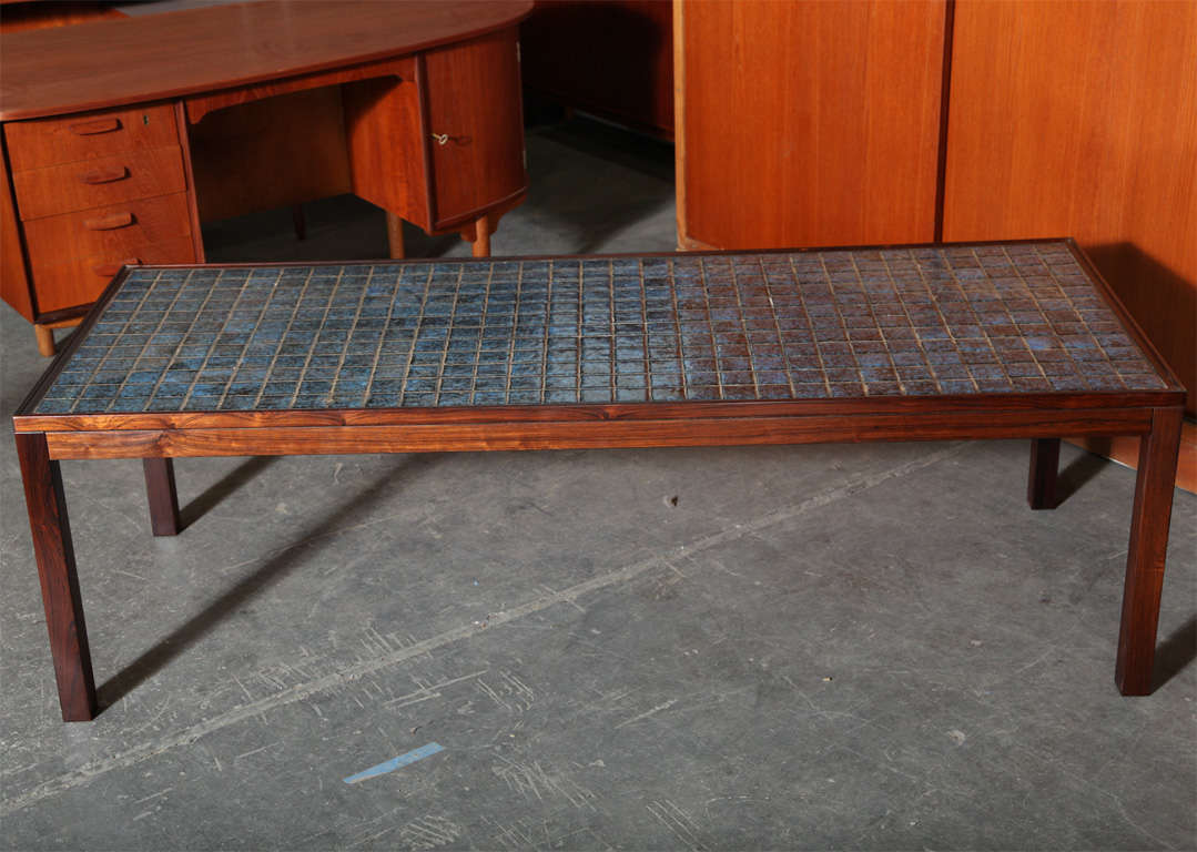 Vintage 1960s Midcentury Modern Coffee table with Blue Ceramic Tiles.

This Large Vintage Coffee Table is in excellent condition, and a great way to add color to any living room, den, or family room. The tiles are great because you don't need a