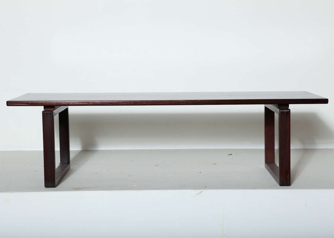 Low Rosewood Bench with sleigh style legs, exposed joinery and spectacular wood grain. Well-suited for an entryway or as a low coffee table.