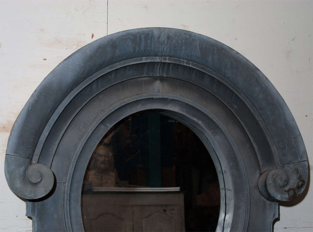 A Very Large Oeil De Boeuf Zinc Mirror with New Mirror with Wonderful Early 20th Century Architectural Frame.
Oval Mirror Size: 30