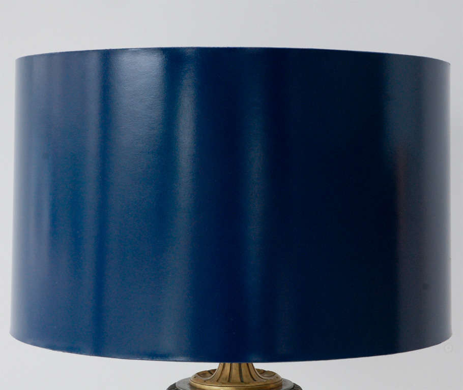 A handsome empire-style steel and bronze floor lamp with a custom  navy blue enamel shade. Possibly by J.E. Caldwell. Newly rewired.