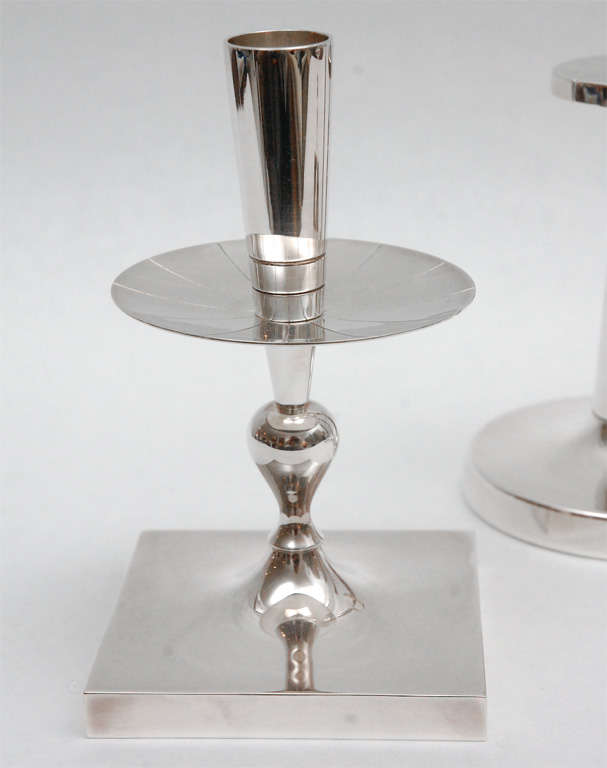 One pair of lovely silver plated candlesticks featuring classic Parzinger details in beautiful silver plate made by Dorlyn Silversmiths.  The taller pair has been SOLD. The shorter pair measure 7