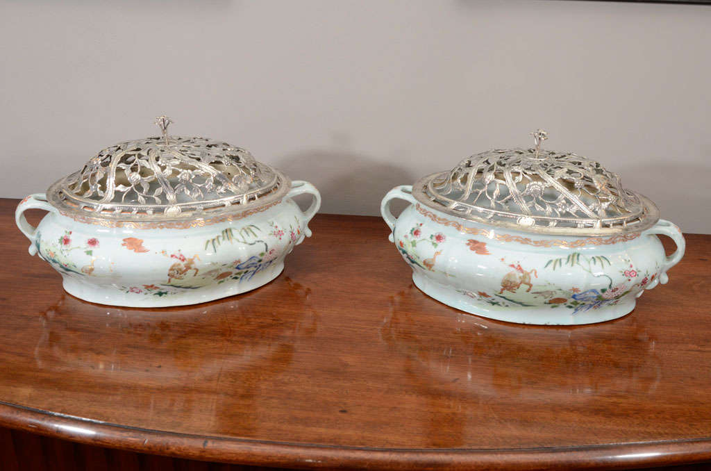 These tureens are in the famille rose palette and were made for the export market in the 18th century during the Qianlong emperor’s reign (1735-1796). The bright in tone and thickly applied enamels, along with the gilt decoration, are typical of