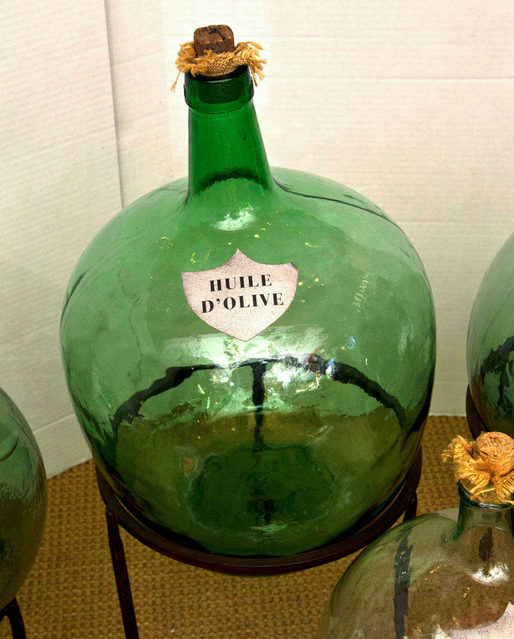 A Collection of French Green Glass Demijohns 1