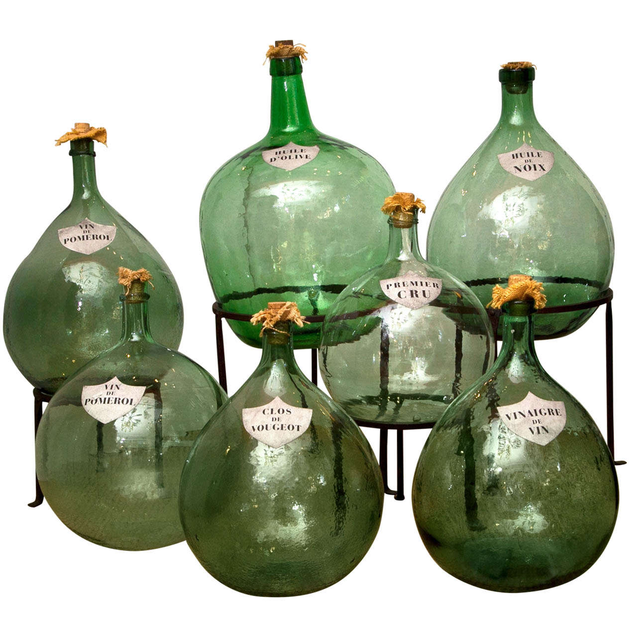 A Collection of French Green Glass Demijohns
