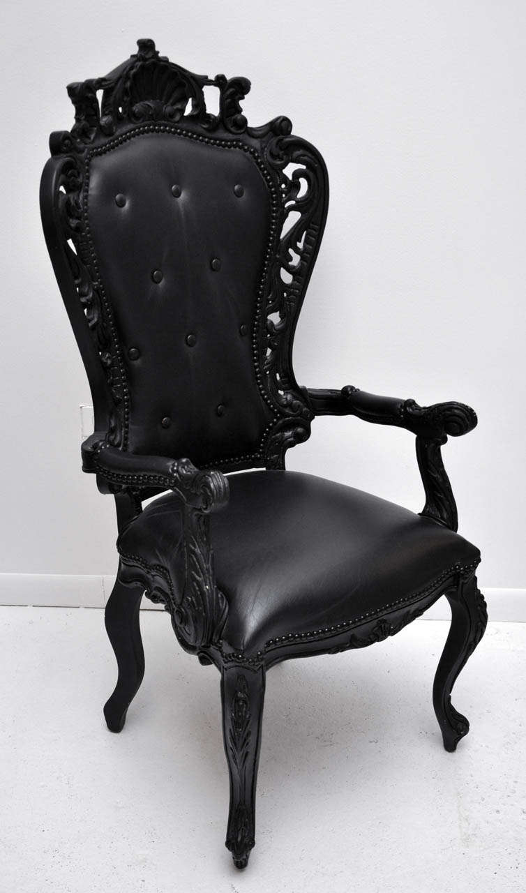 These intricately pierced hand-carved chairs are a high-quality 1950s interpretation of John Henry Belter's 1850s laminated-rosewood-&-black-horsehair version of a Louis XV fauteuil of the 1750s. Recently painted satin black & upholstered in