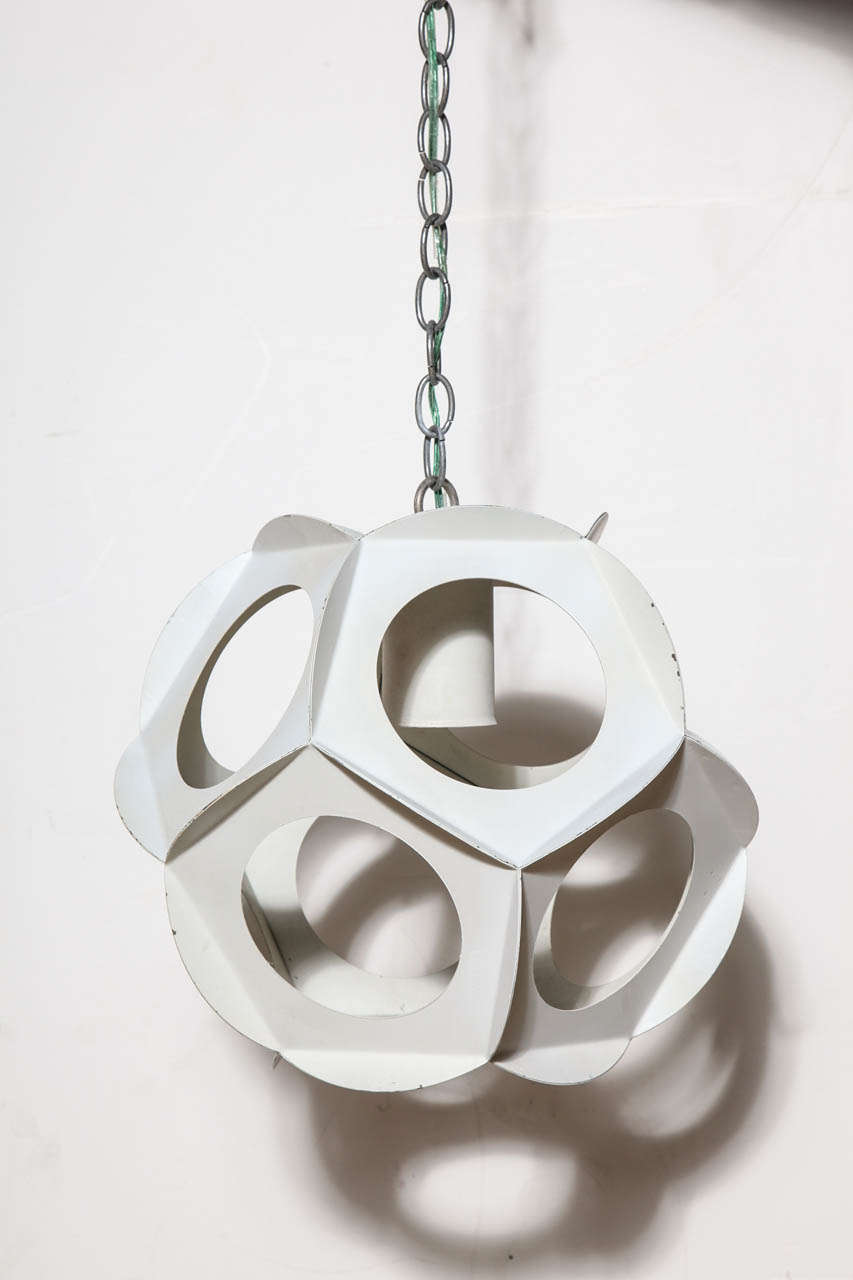 Pair of Mid Century Nine sided Off White enameled Steel Adjustable Hanging Lamp. Featuring nine round geometrical cut outs with surround. In the manner of Preben Dahl for Hans Følsgaard. Nonagon. Space Age. Beautiful light. Utilize large Decorator