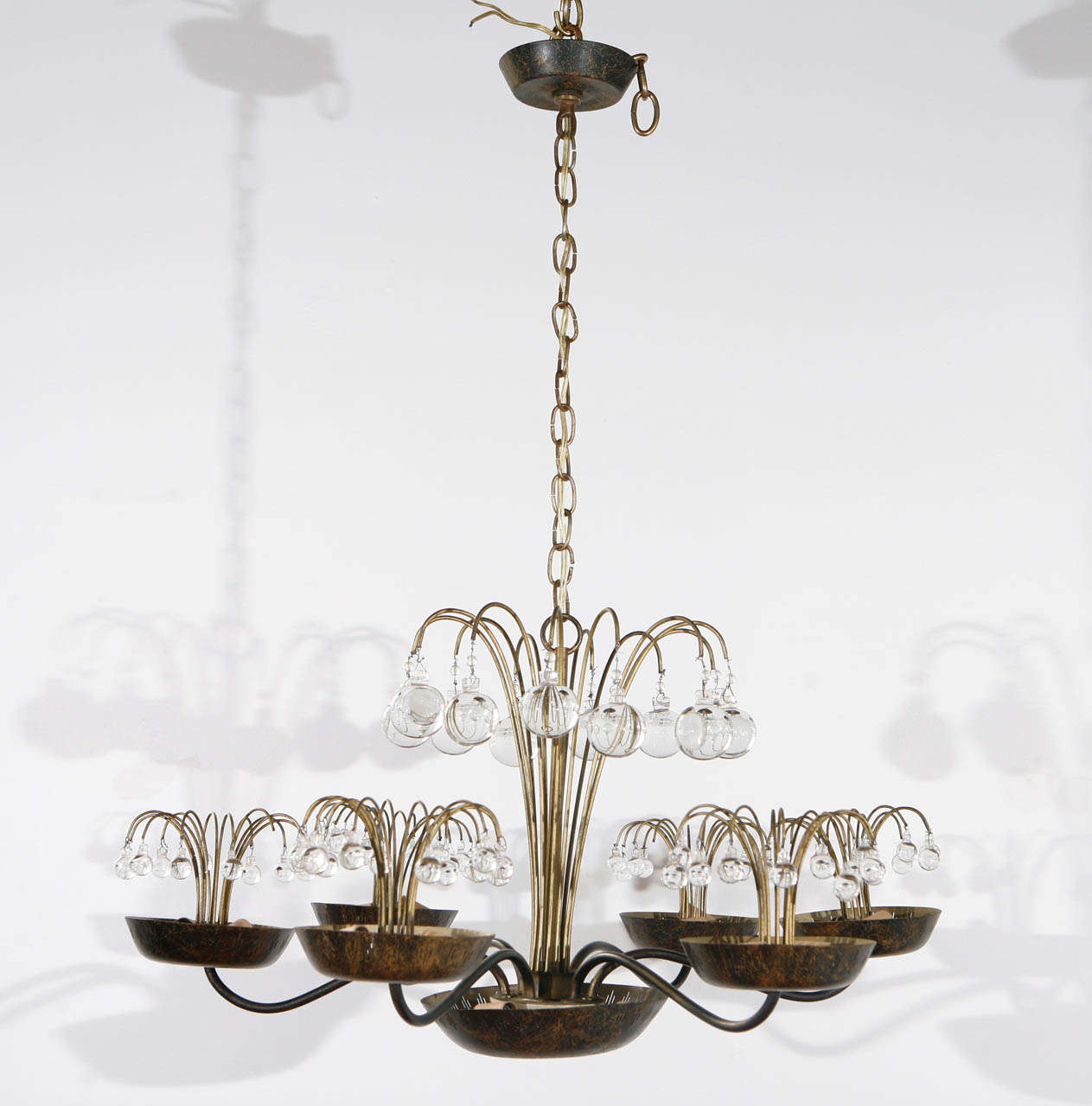 Delicate chandelier; 15 candelabra sockets each take a 60 watt bulb.