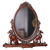A magnificently carved cheval / vanity mirror