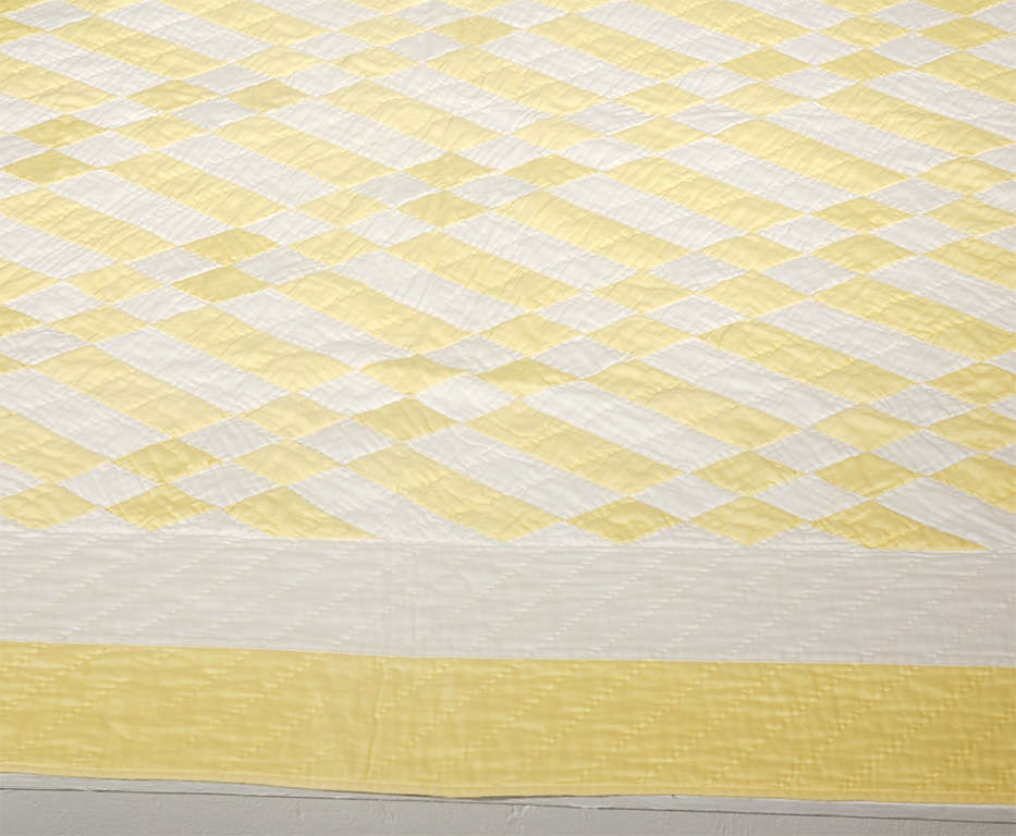 YELLOW AND WHITE POLISHED COTTON GEOMETRIC QUILT.THE CONDITION IS VERY GOOD.IT IS MADE OF A SOFT NICE POLISHED COTTON SATEEN FABRIC.THE BACKING IS A SOLID YELLOW POLISHED COTTON.