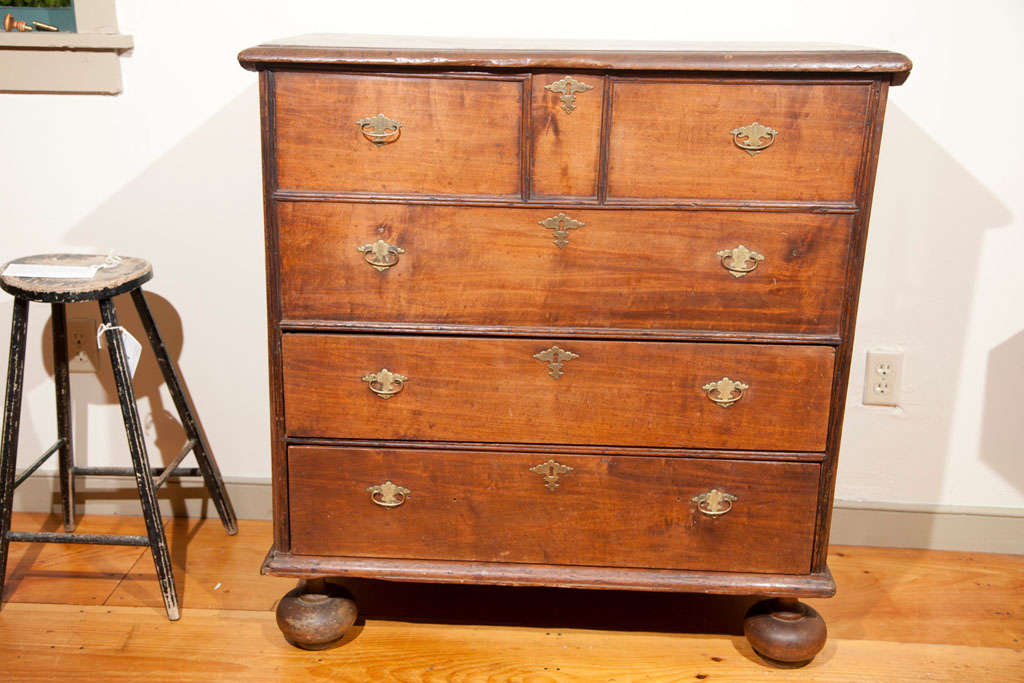 A William and Mary 2-Drawer Ballfoot Blanket Chest, <br />
New England. This chest is maple and pine with a mellow old patina. The chest is entirely original with the exception of replaced hinges and several upper drawer pulls/ escutcheons. A rare