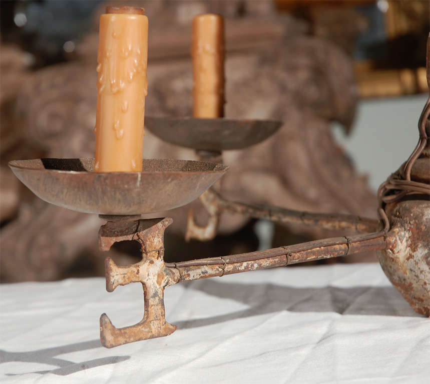 19th century wrought iron weathervane with great patina converted to to (4) light primitive chandelier with golden wax candle covers.