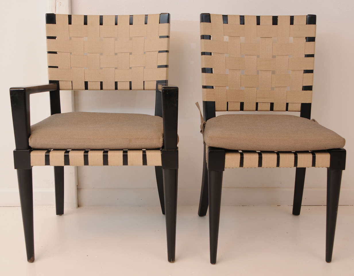 Set of 8 1980's chairs (2 arm chairs & 6 side chairs) designed by Vincente Wolf for Niedermaier.  Wenge wood with light tan webbing and brass nail heads.  Side chairs measure 35 in. H (back) x 16.5 H (seat without cushions) 19.5 in. L x 18 in. D.