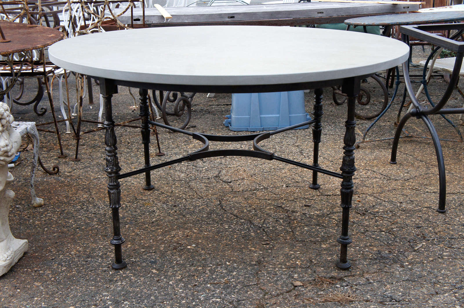 Wonderful iron base table with stone top.  Can be used indoor or outdoors.  Perfect kitchen, dining or center hall table.  Top and base can be sold separately.  Stone top:  $1500; Base:  $3300.