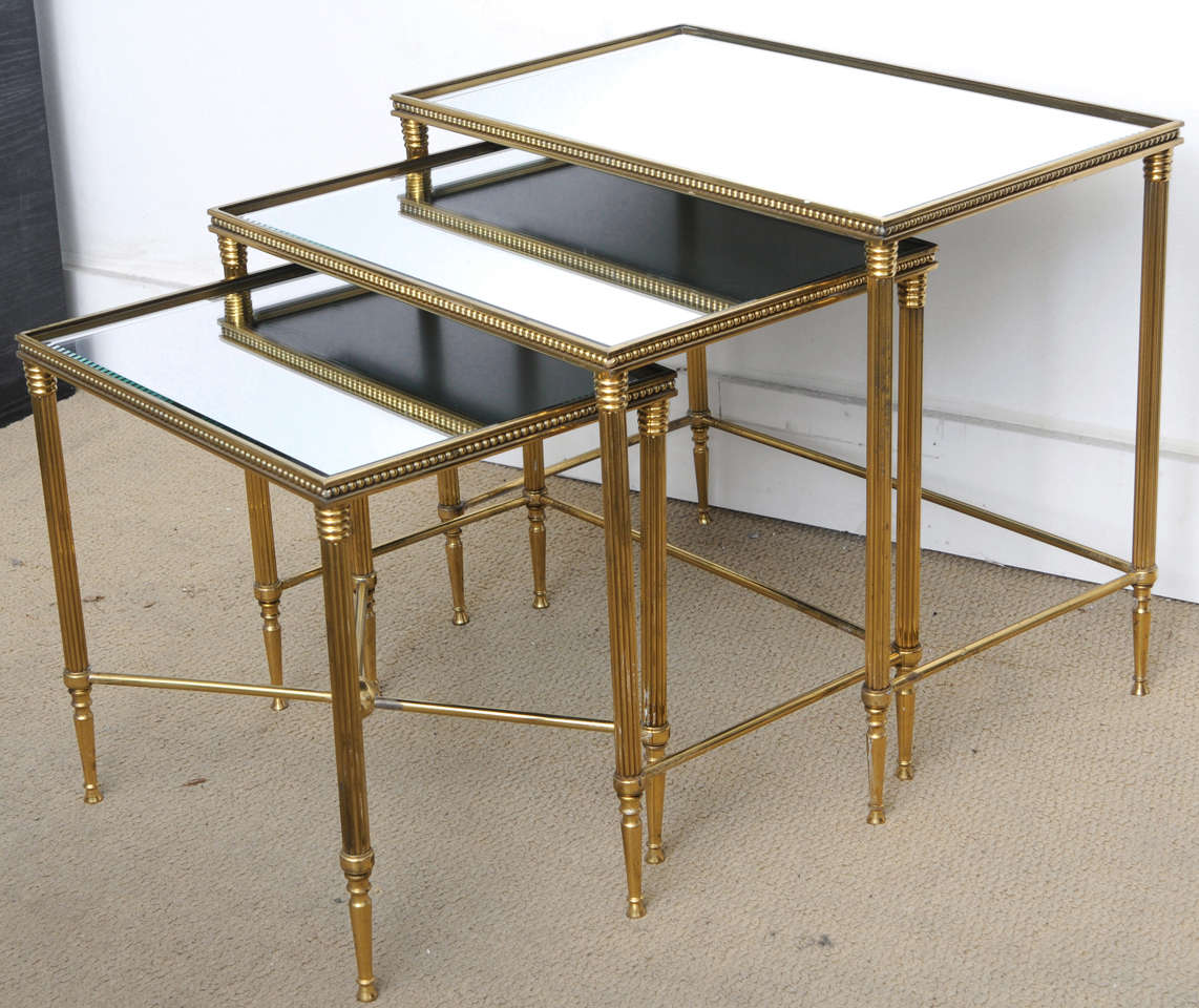 These nesting italian tables date from the late 60,s early  70, s . they are in very good original condition with no damage on the metal or the mirrored tops, just normal wear for there age.