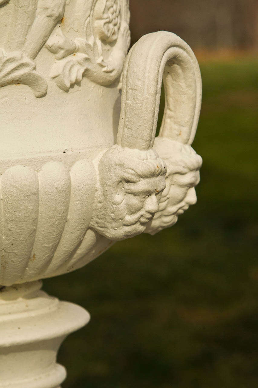 Pair of Neoclassical Mask and Loop Cast-Iron Urns 1