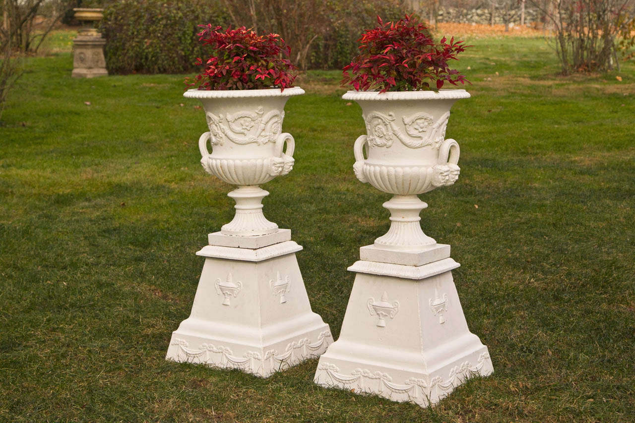 19th Century Pair of Neoclassical Mask and Loop Cast-Iron Urns