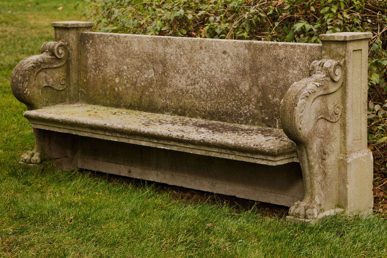 A fine carved stone seat with unembellished back panel and with monoped lion's paw supports, each support topped with acanthus leaf volute.

Provenance: Beacon Hill House, the Newport, RI estate of Arthur Curtiss James, built in 1910. When Beacon