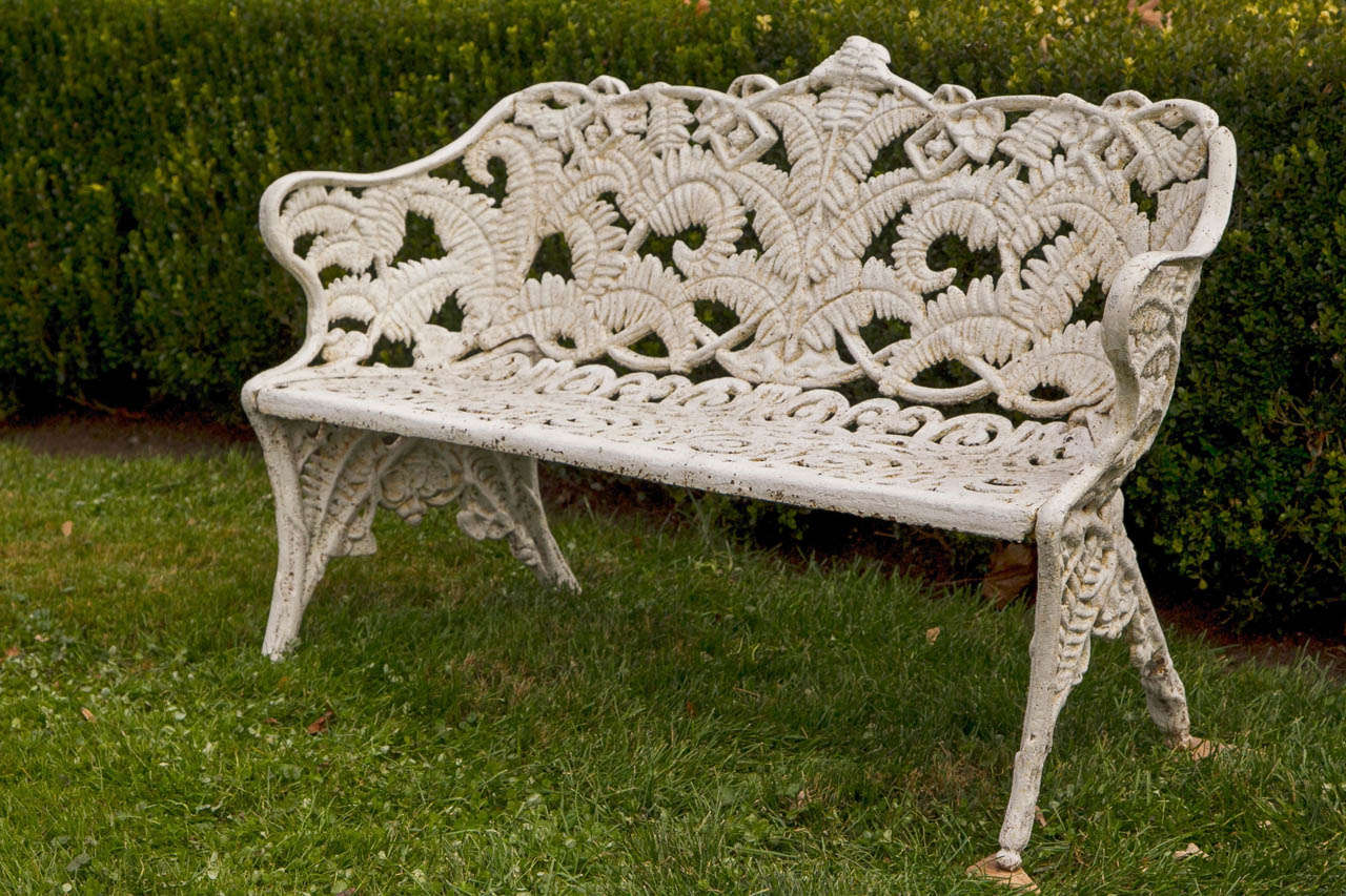 A cast-iron settee in the fern and blackberry pattern.