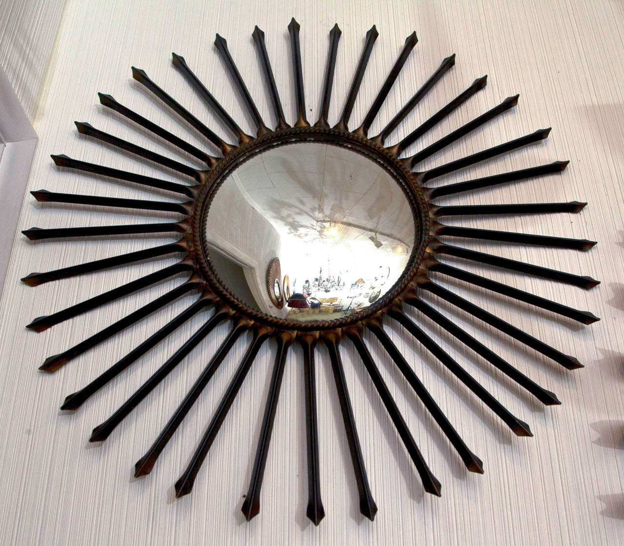 Metal arrow sun ray mirror.