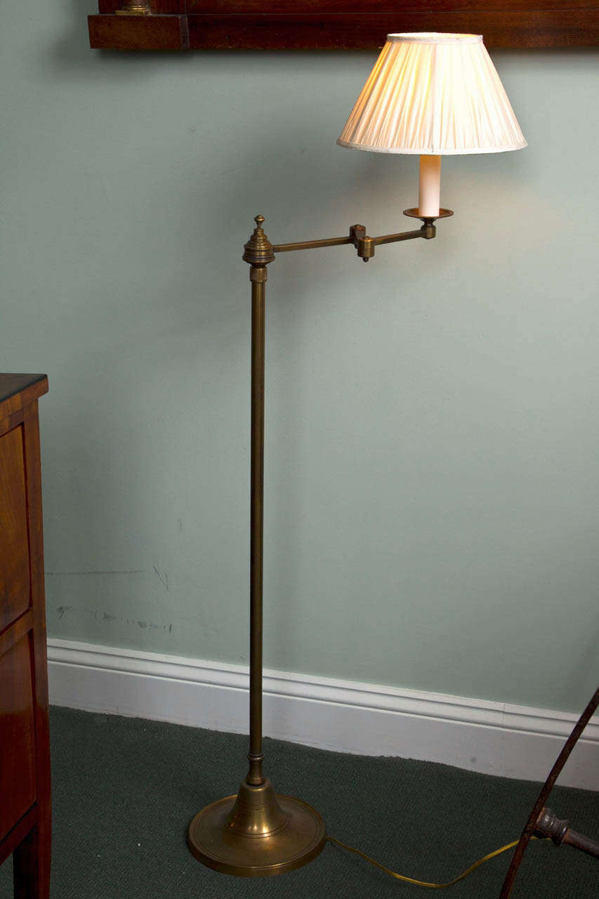 A set of three quality Parisian standing swing lamps in solid brass with a clever push switch located at the top of the standing pole from Marie Christine de La Rochefoucauld, Paris.
(note heaviness)
Dimensions: 
minim height with a shade