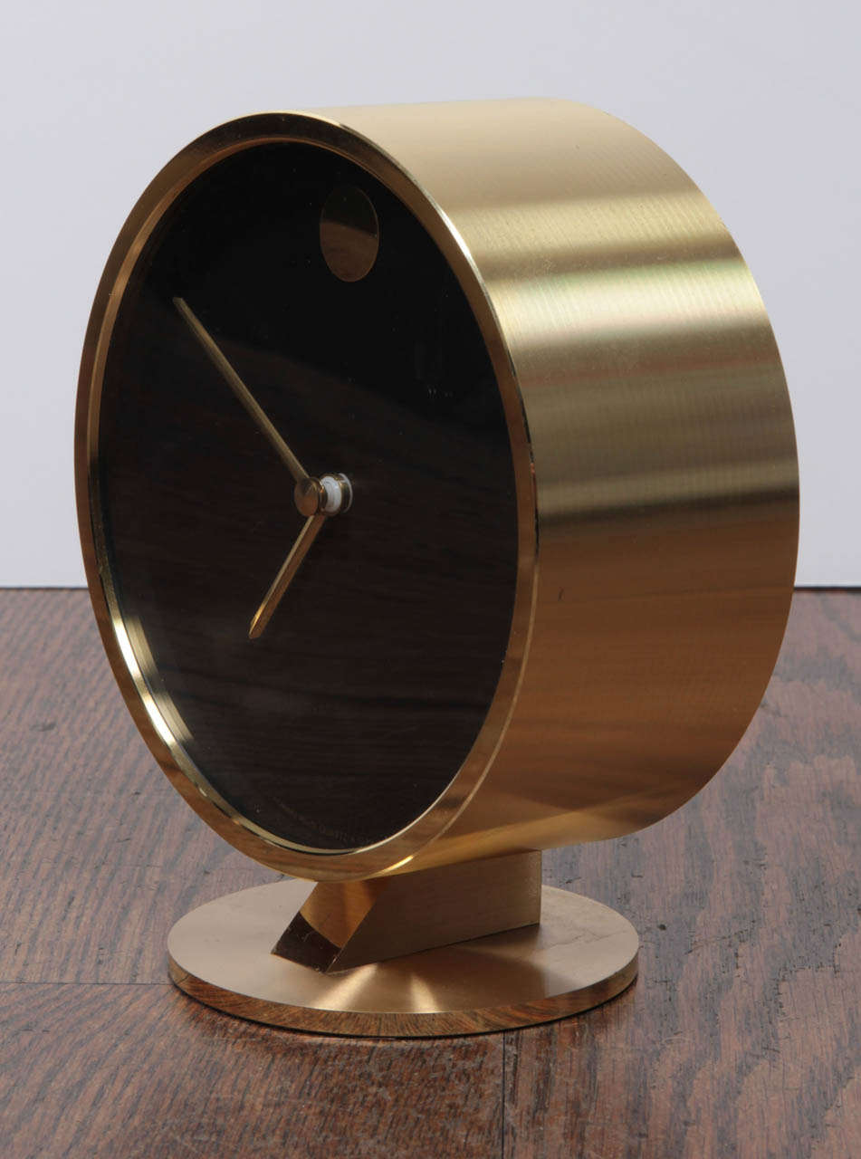 A gorgeous mid-century brass desk clock by Howard Miller. Battery operated. Runs perfectly.