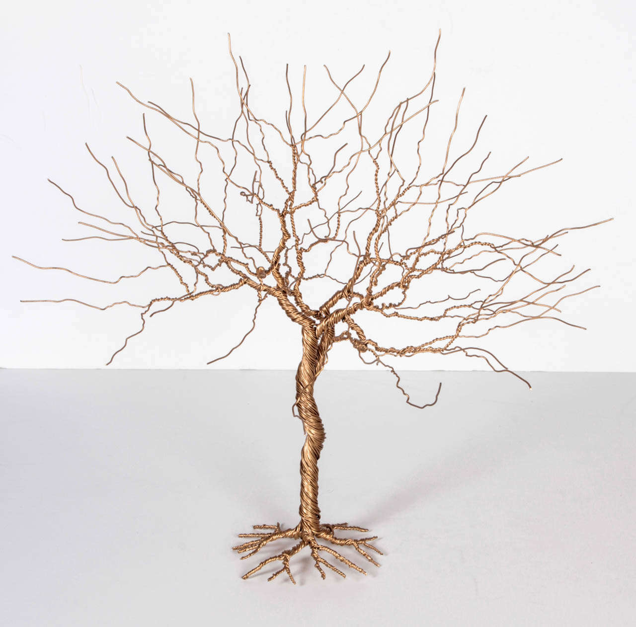 New York artist Mauricio Santelice spends two days hand twisting these stunning gold steel trees that add a new twist on organic sculptures. Each piece is unique.
Three sizes available: 13
