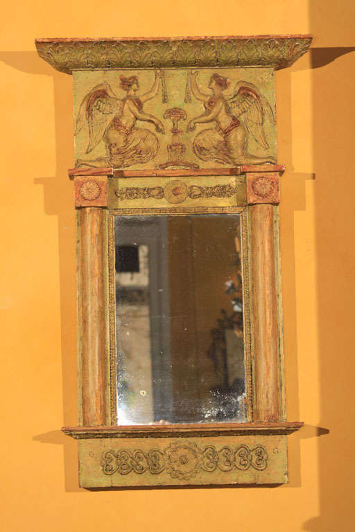 A charming Italian small painted pier mirror in original decoration decorated with rosette medallions and classical figures