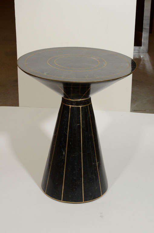 Exceptional tessalated marble table with conical base and brass pinstripe inlay.