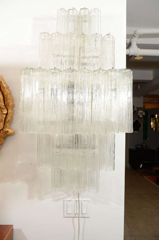 Fantastic pair of large-scale five-tier cascading glass tube wall sconces. 