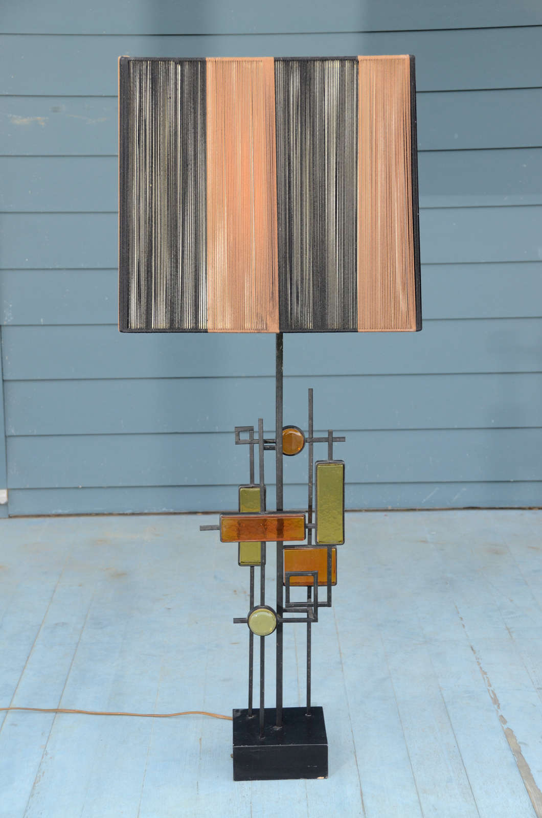 Danish 1960's Table Lamp, Wood Base supports Iron Shaft with Geometric Ornament & Yellow & Orange Glass Lozenges.  Danish, circa 1960.  Retains early Cord Lampshade.  Designed by Svend Aage Holm Sorenson.