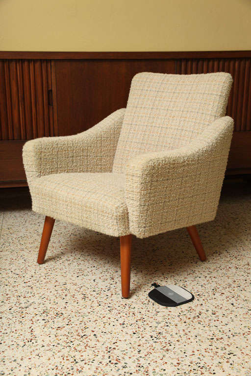 SOLD FEB 2013 First offered by Norsk in NYC in the 50's, this handsome and comfortable armchair retains its original boucle fabric.  Smart, with a fun undulating shape to the arms and back.  Teak tapered legs.  Quite nice... a Swedish Danish modern