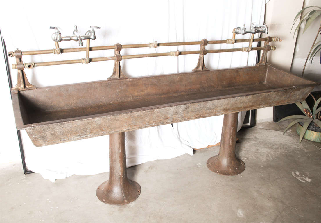 Unusual heavy cast iron double sink on two pedestals with original fittings. Raw industrial beauty... Just great!