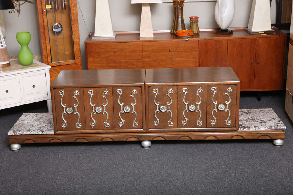 REDUCED FROM $2,850.
Definitely with James Mont inspirations and Renzo Rutili as well, this exquisite credenza with movable cabinets and marbles is a delight. Supporting two cabinets and marbles, the molded and shaped walnut base with turned bell