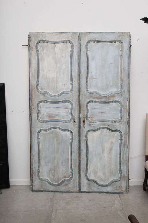 Light blue with darker blue molding, original iron hinges