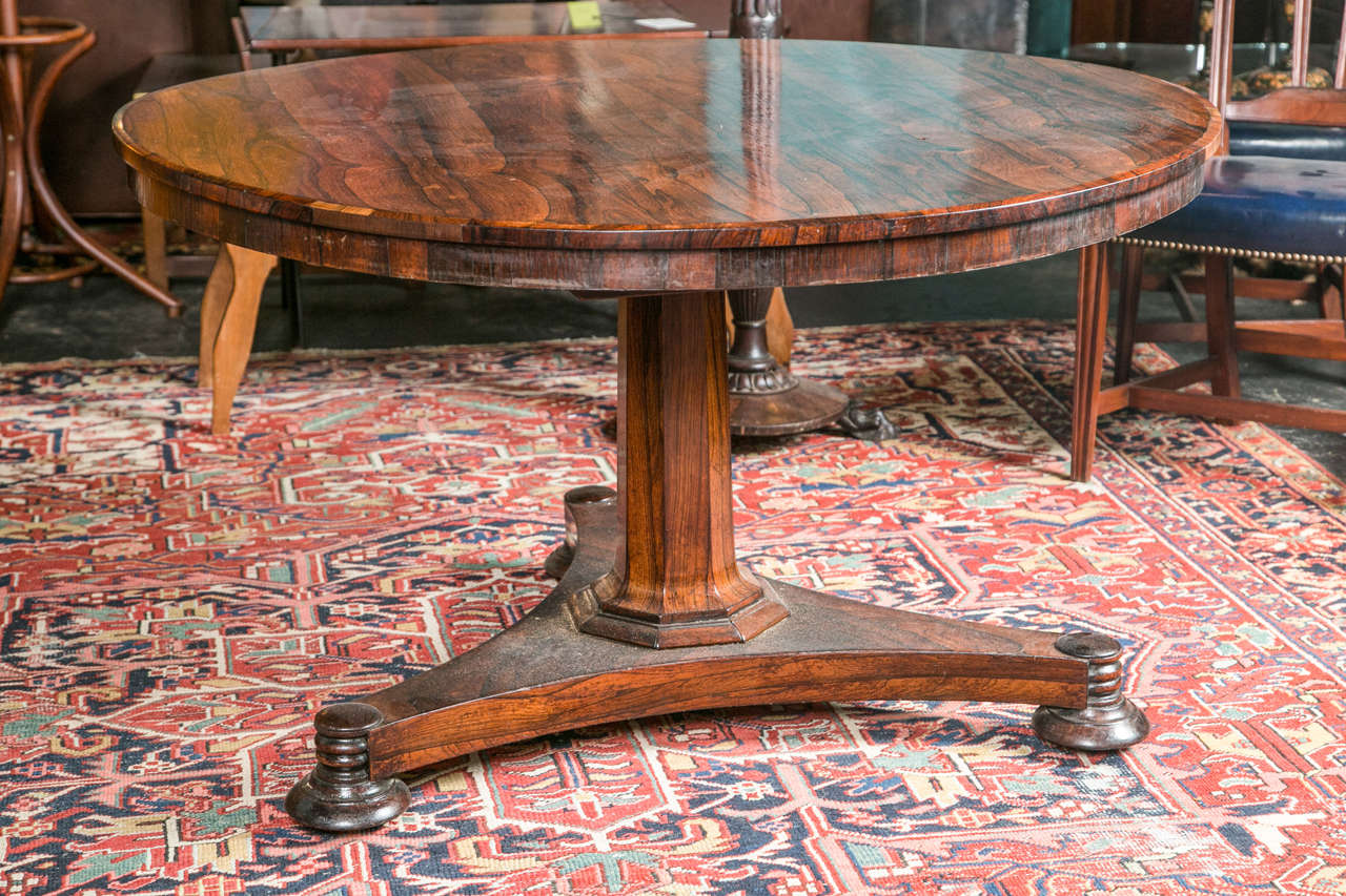 Regency Rosewood round  tilt top Breakfast Table on tri form base with turned bun feet and castors. England