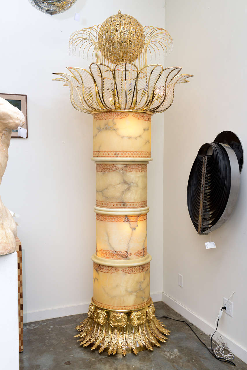 Unusual and impressive lighted alabaster palm tree floor lamp. The entire piece lights within as well as the ball on top! A spectacular show piece for a hotel or restaurant.