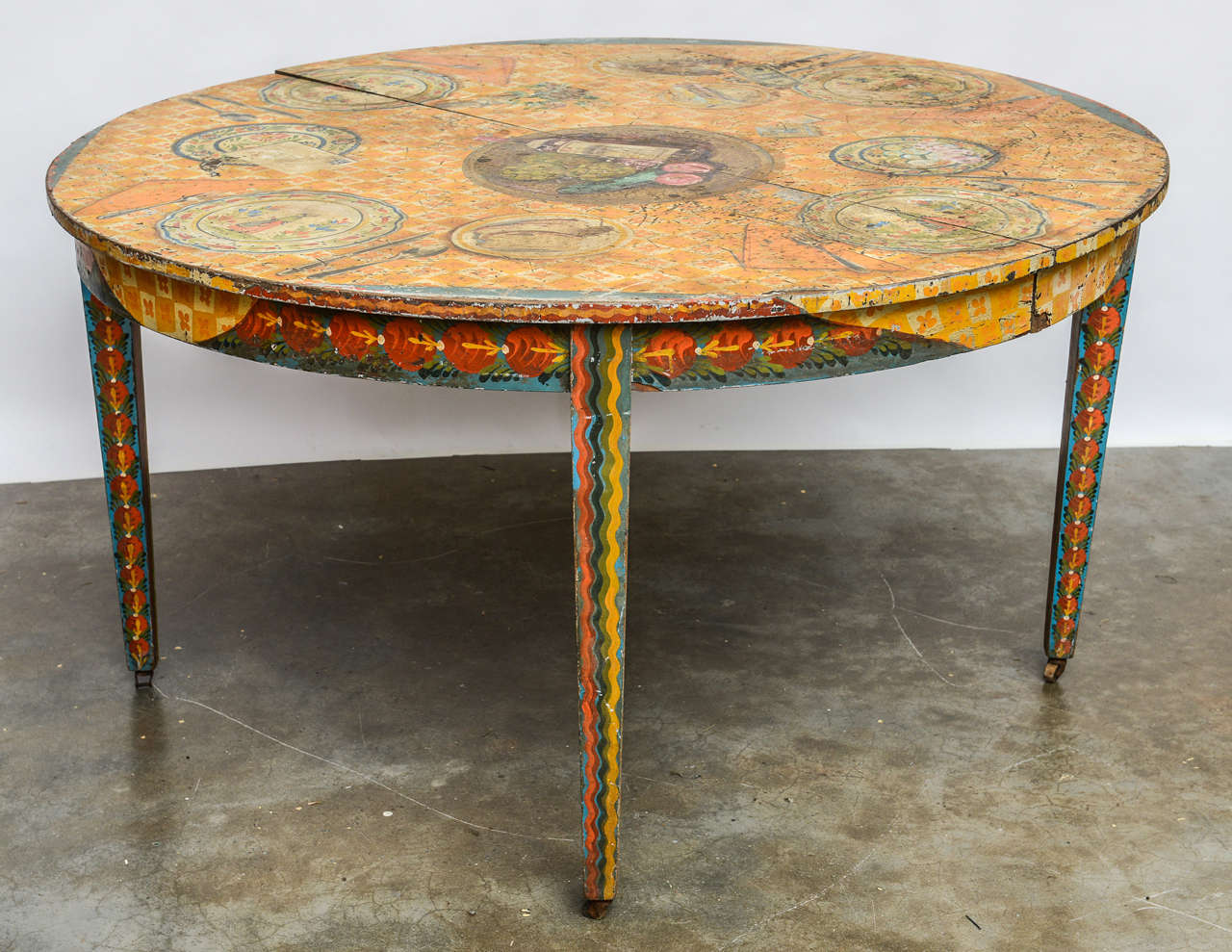 Fantastic hand painted table in Peter Hunt style, depicting a Quimper table setting. By artist Nancy Whorf.