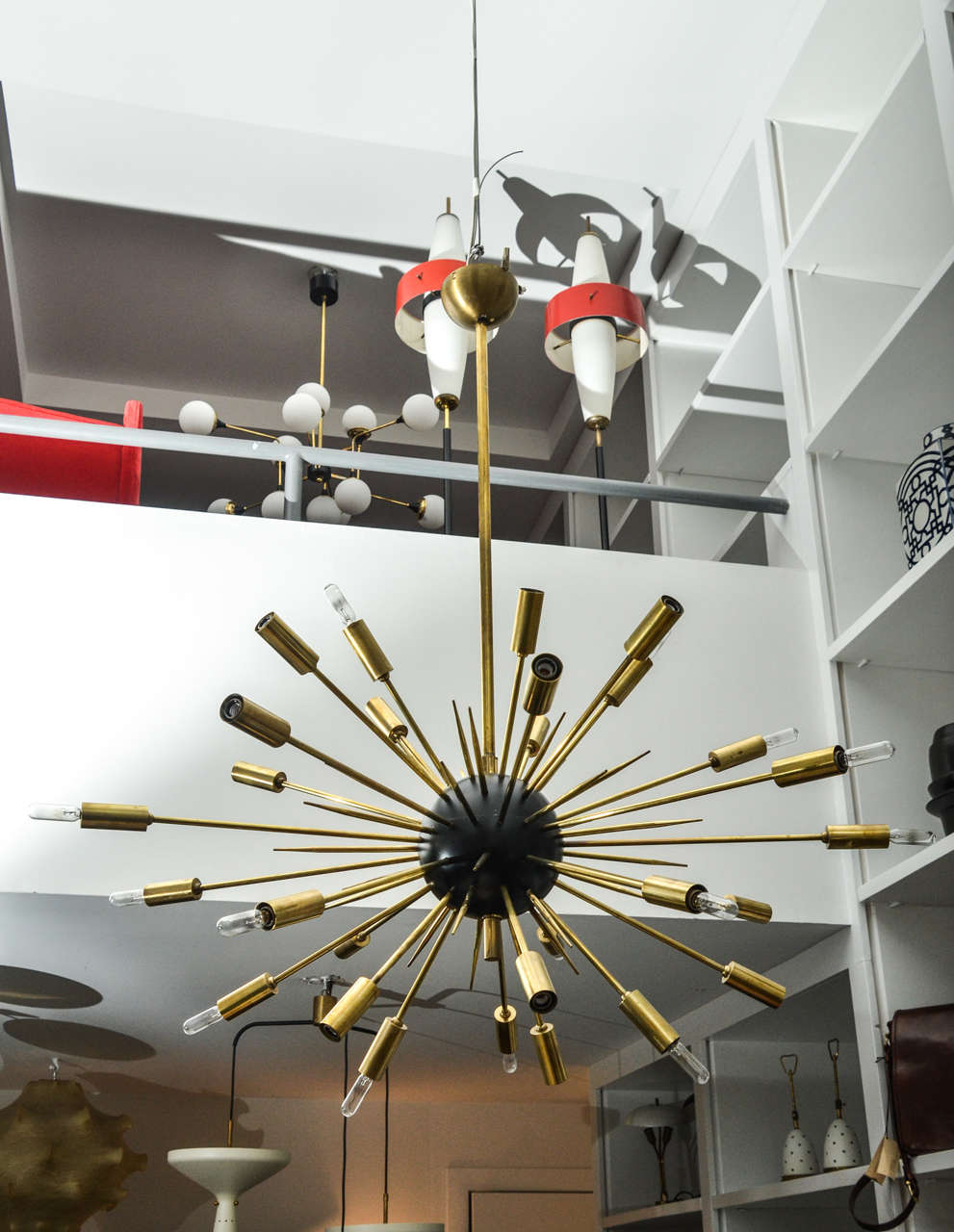 Beautiful brass and black enamel Sputnik chandelier from Stilnovo with twenty-four lights.