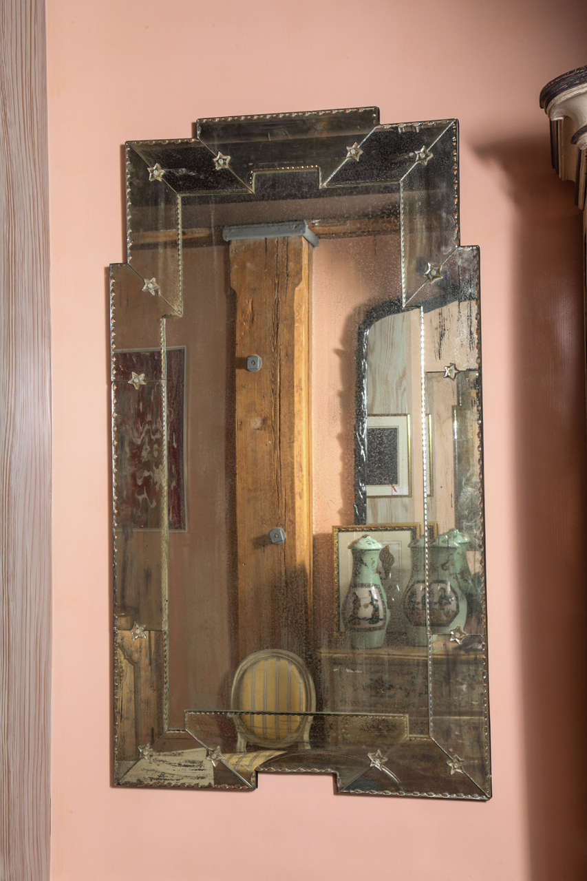 A 20th Century Venetian Style Mirror with Stepped Top and Surrounding Center Beveled Glass