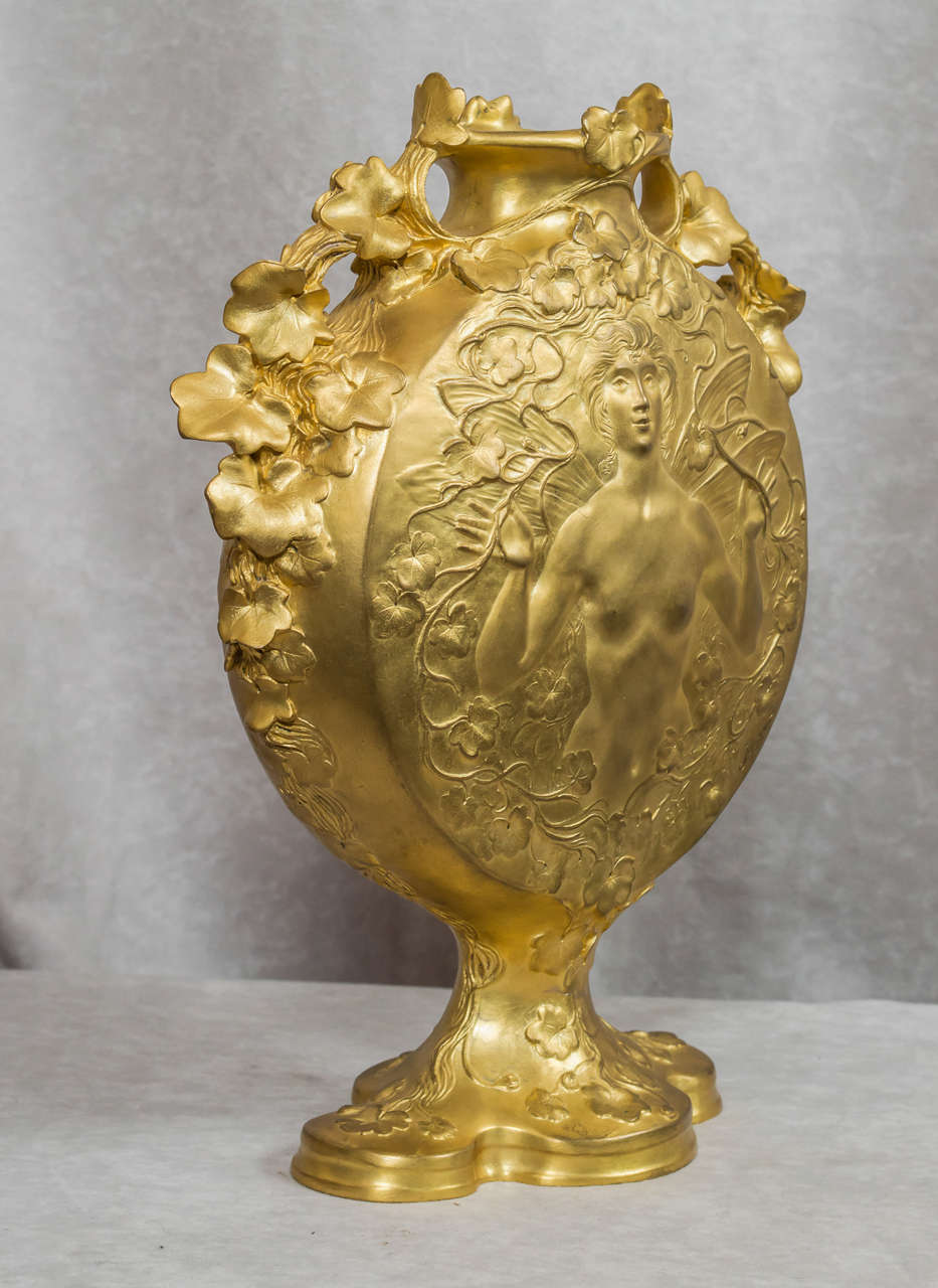 A luscious gilt art nouveau bronze vase by Jules Jouant. The vase has all the fine details that make art nouveau the beautiful movement that has attracted people for over 100 years. Flowers, sinewy lines,and the beautiful nude that is all part of
