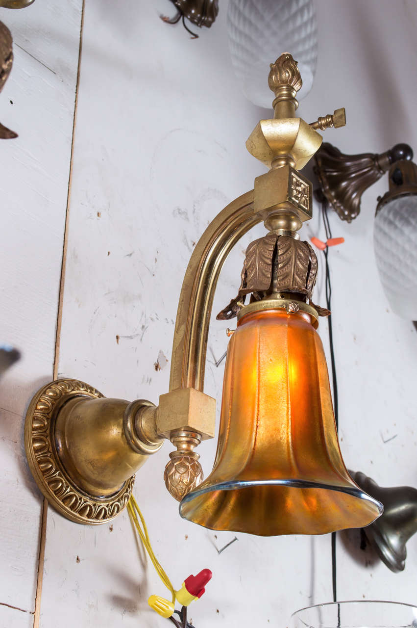 Offering a very high quality pair of American late Victorian pair of sconces. High quality casings and original handblown shades, probably by Steuben, makes these a fine addition to any home. These have never been polished. That is the original