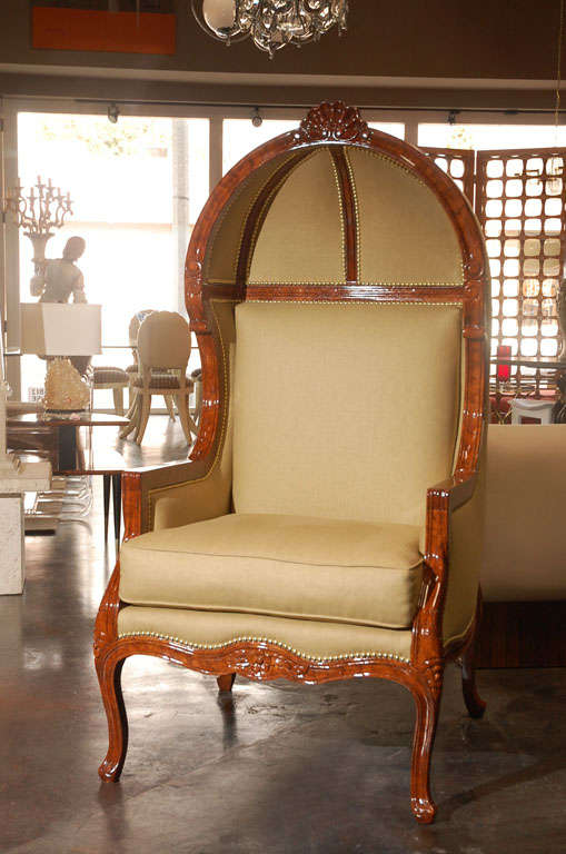 A wonderful pair of canopy armchairs with faux tortoise shell finish and polished brass nail heads.